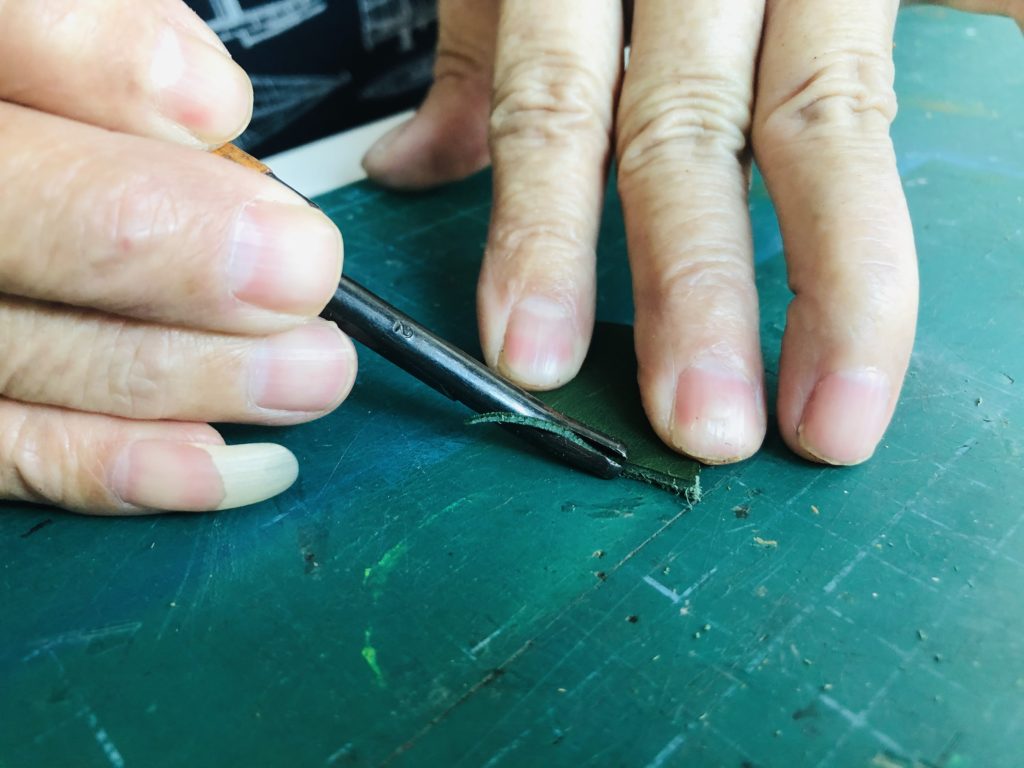 Using edge trimming knife to refine tear drop shape